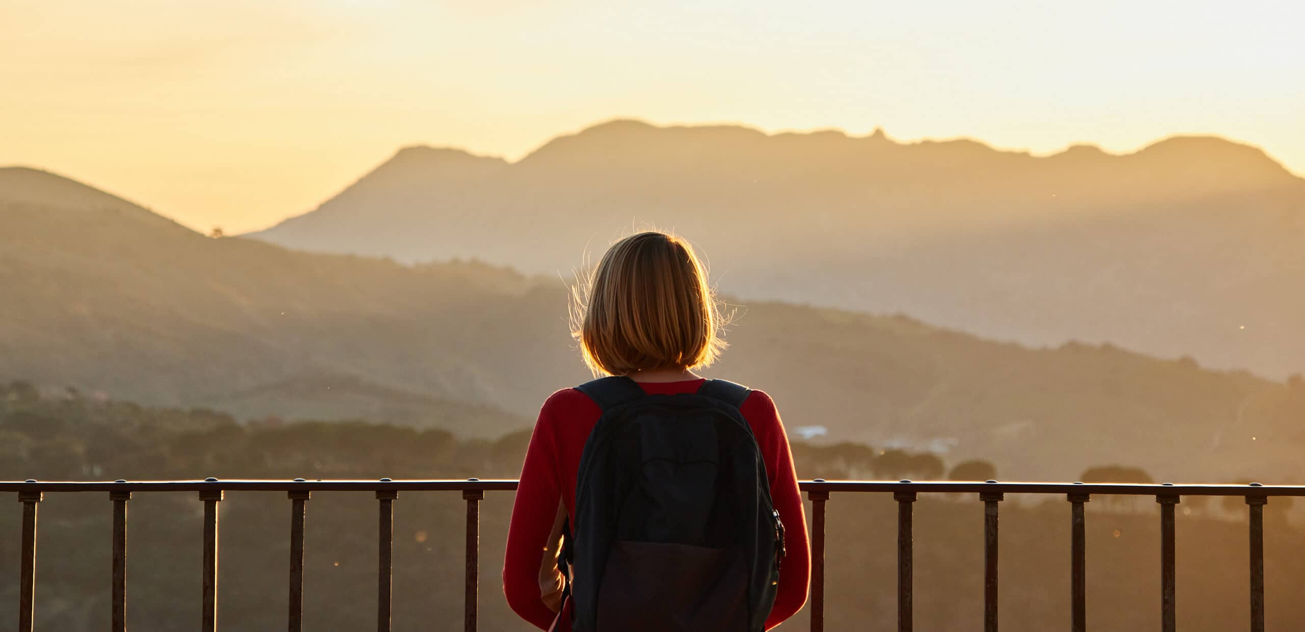 Woman standing at a viewpoint overlooking the Serranía de Ronda