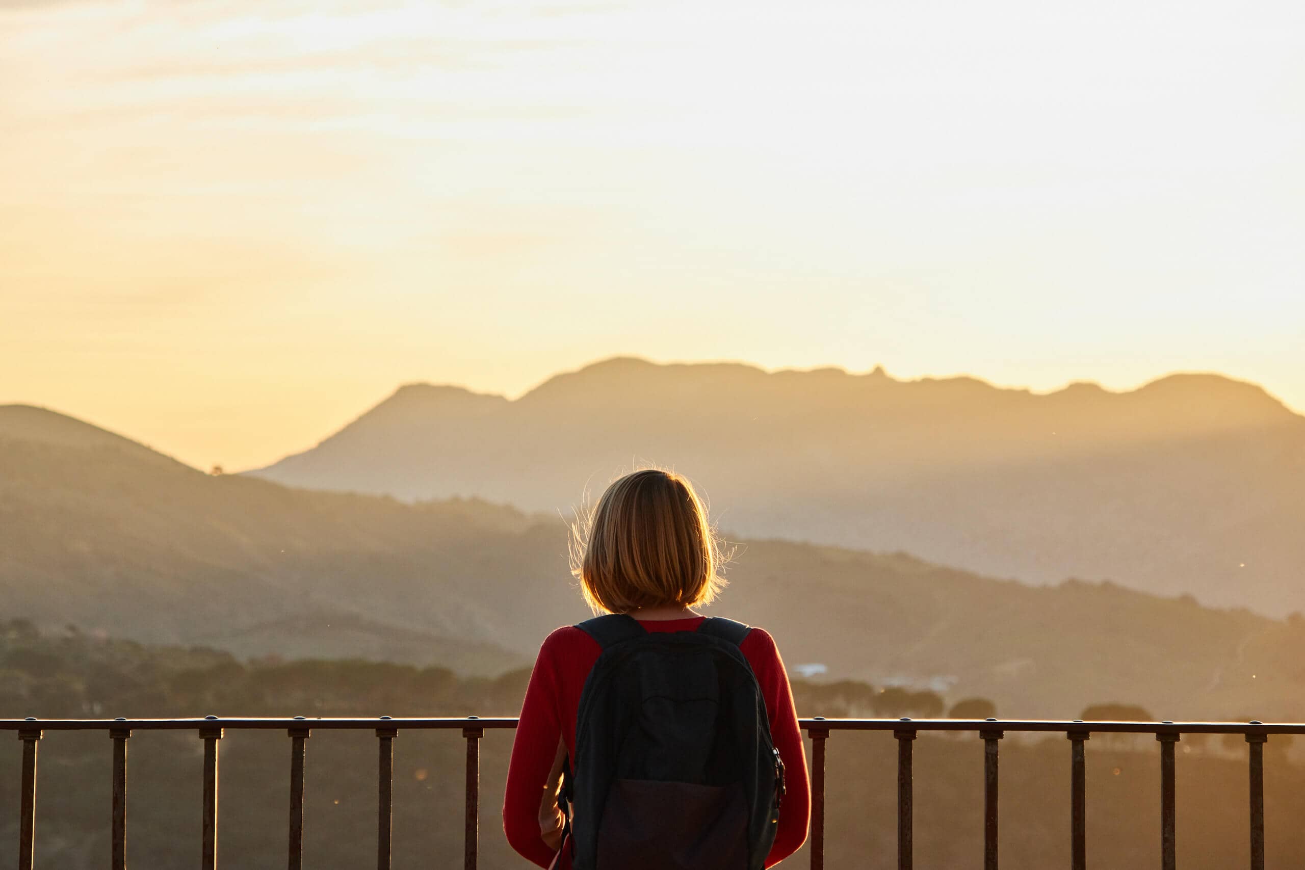 Woman standing at a viewpoint overlooking the Serranía de Ronda
