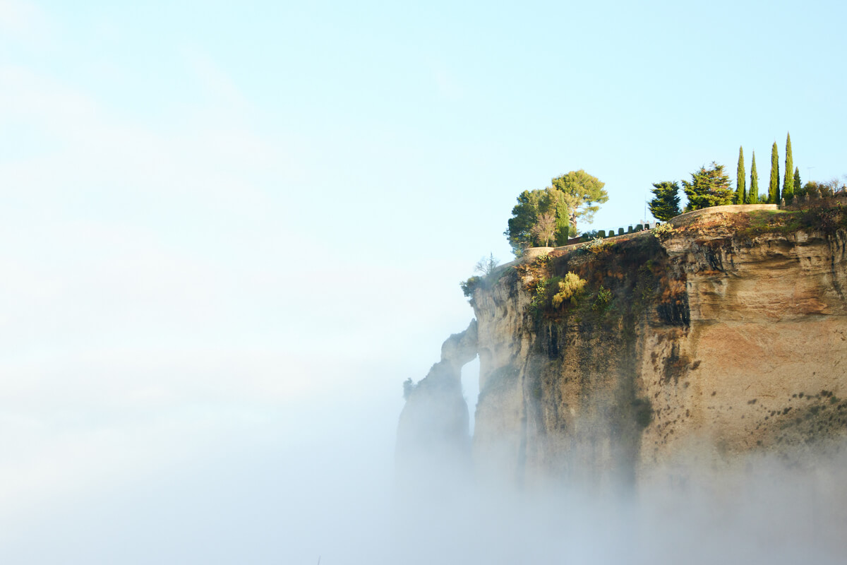 Fog on the cliffs overlooking the Tajo gorge in Ronda